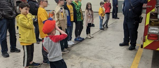 Scouts learning from a fireman