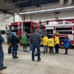 Scouts Exploring a Fire Truck at the Butler City Fire Department