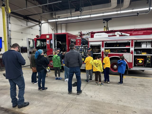 Scouts Exploring a Fire Truck at the Butler City Fire Department