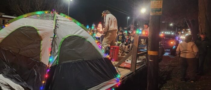 Scouts setting up their float for the Spirit of Christmas Parade